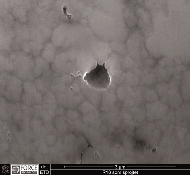 SEM picture of cross-section made by focused ion beam technique (FIB), as-sprayed