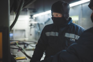 Man looking at vehicle
