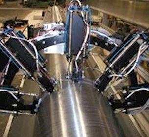 The AMS-14 scanner set-up with ultrasonic probes mounted in a frame perpendicular to the pipe axis reduces inspection time from 55 to 11 hours per unit.