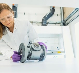 Woman assessing a component