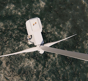 Two offshore workers on the top of the windmill, wind farm