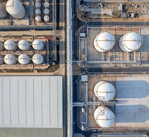 Aerial view of conveying equipment and storage tanks in a chemical plant