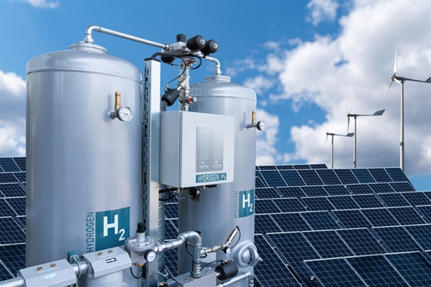 Hydrogen tanks in front of solar panels and wind turbines